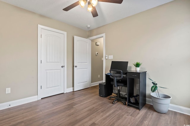 office featuring hardwood / wood-style flooring and ceiling fan