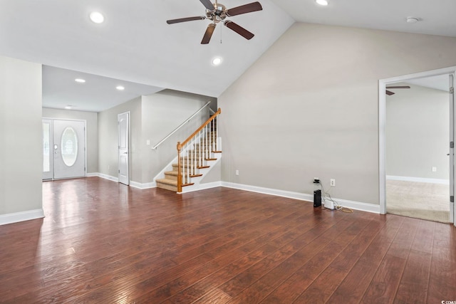 unfurnished living room with ceiling fan, dark wood-type flooring, and vaulted ceiling