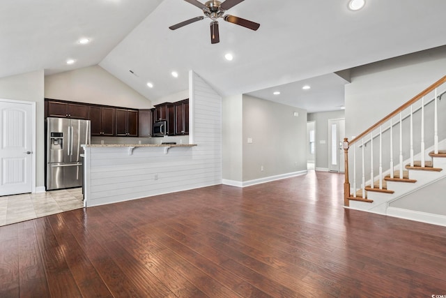 unfurnished living room featuring light hardwood / wood-style floors, high vaulted ceiling, and ceiling fan