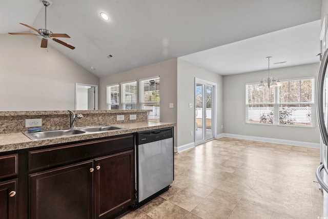 kitchen with ceiling fan with notable chandelier, sink, dishwasher, hanging light fixtures, and lofted ceiling