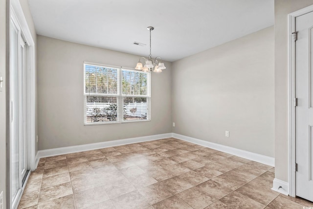 unfurnished dining area with a chandelier