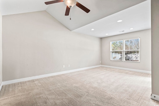 empty room featuring light carpet, ceiling fan, and lofted ceiling