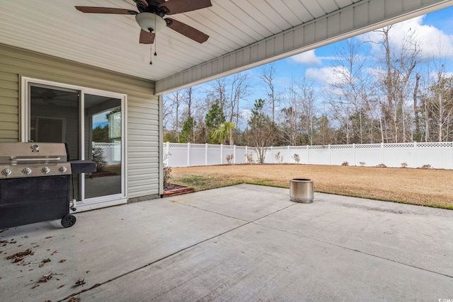 view of patio with ceiling fan and a grill