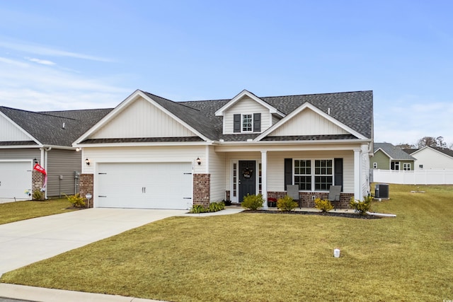 craftsman-style house featuring a front lawn, a porch, and a garage