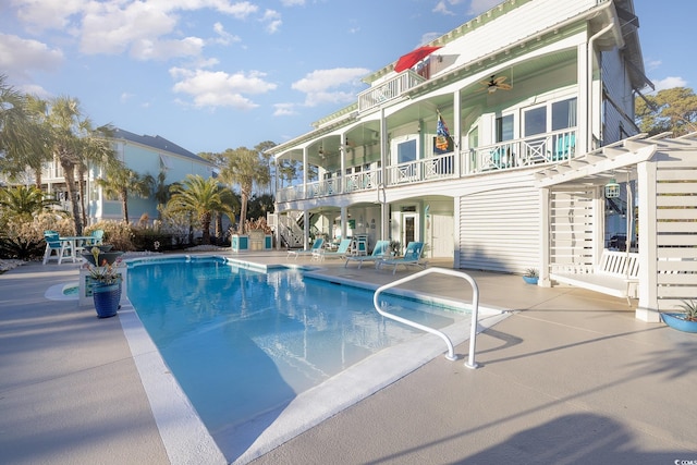 view of swimming pool with a patio area