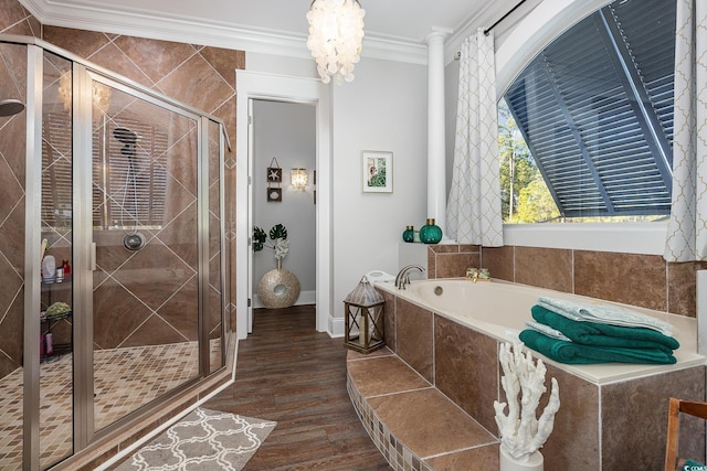 bathroom featuring a notable chandelier, separate shower and tub, wood-type flooring, and ornamental molding