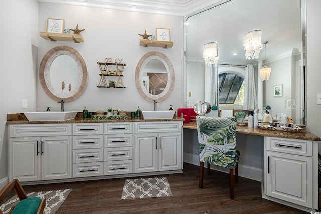 bathroom featuring wood-type flooring, vanity, and crown molding