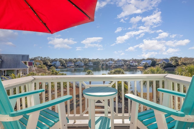 balcony featuring a water view