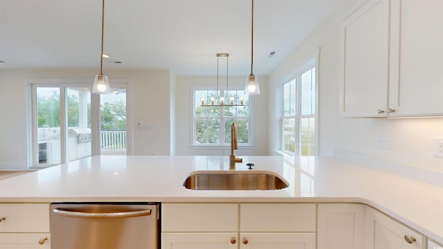 48 Furman Ln, Pawleys Island, SC 29585 - kitchen with stainless steel dishwasher, plenty of natural light, and light countertops