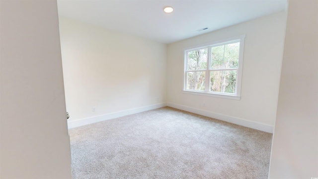 48 Furman Ln, Pawleys Island, SC 29585 - spare room featuring carpet flooring and recessed lighting