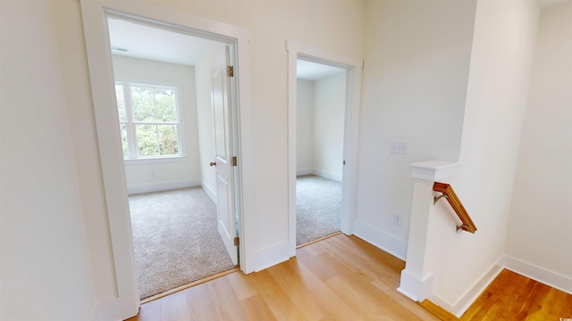 48 Furman Ln, Pawleys Island, SC 29585 - hall featuring an upstairs landing and light wood-type flooring