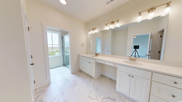 48 Furman Ln, Pawleys Island, SC 29585 - bathroom featuring double vanity, a stall shower, and marble look tiles
