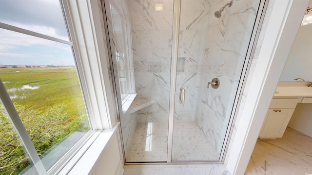 48 Furman Ln, Pawleys Island, SC 29585 - full bath featuring a marble finish shower, vanity, healthy amount of natural light, and marble finish floors