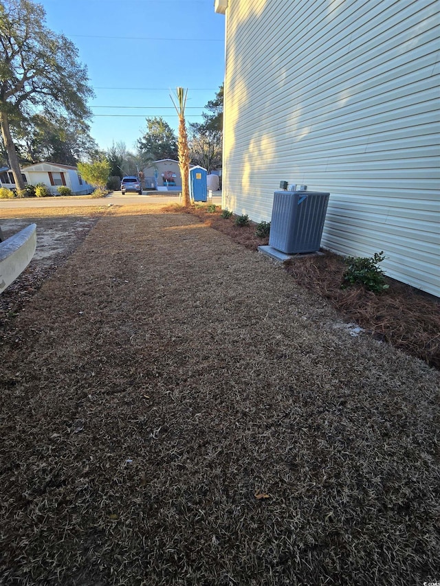 view of yard with central AC