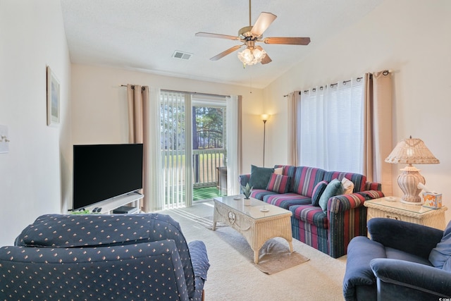 living room featuring vaulted ceiling and ceiling fan