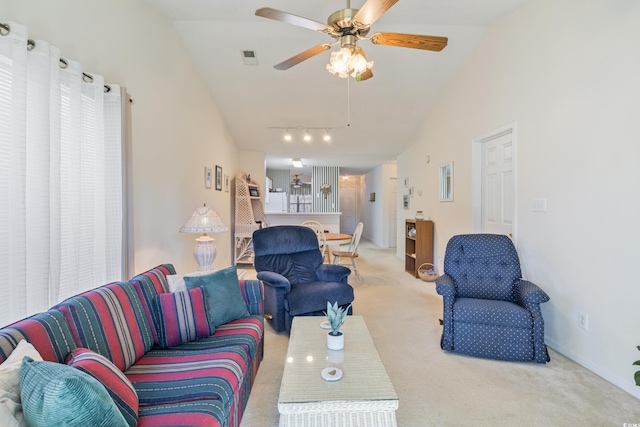 living room featuring ceiling fan, carpet floors, and high vaulted ceiling