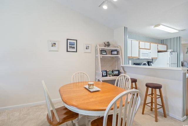 820 Fairway Dr Unit 1605, Longs, SC 29568 - dining space featuring lofted ceiling, light colored carpet, and baseboards