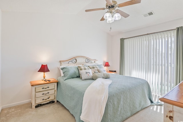 carpeted bedroom featuring vaulted ceiling and ceiling fan