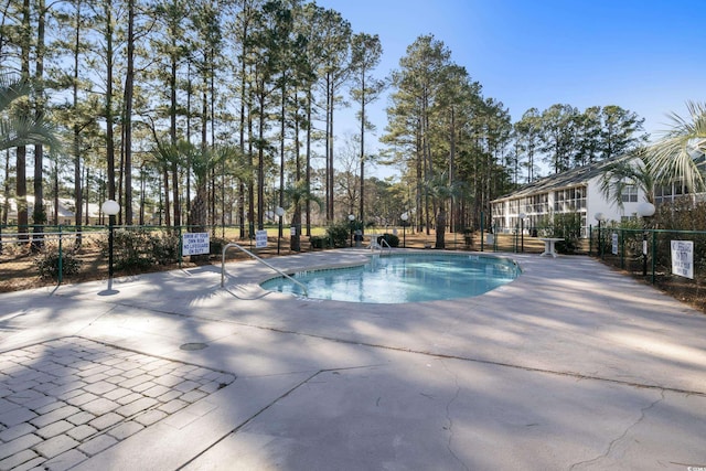 view of swimming pool featuring a patio