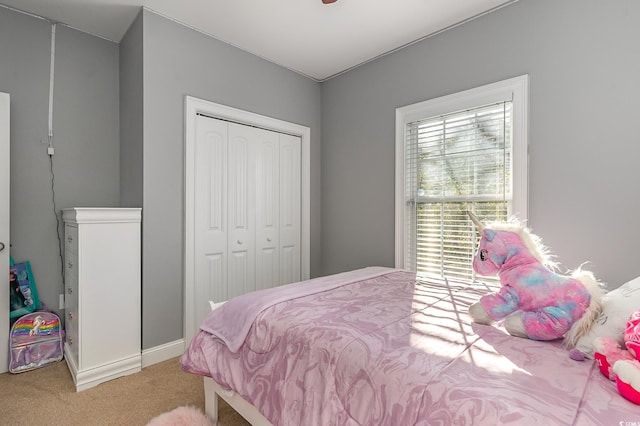 carpeted bedroom with a closet