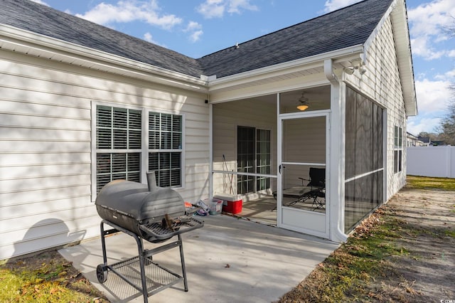 view of patio / terrace featuring grilling area and a sunroom