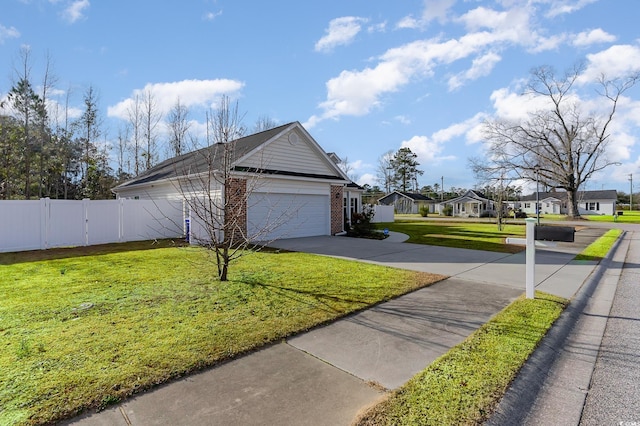 view of side of home featuring a yard and a garage