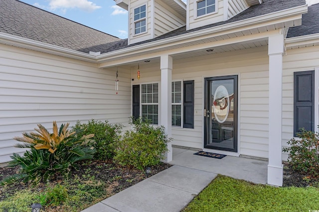 doorway to property with a porch