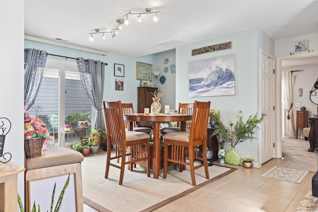 dining area featuring light tile patterned floors