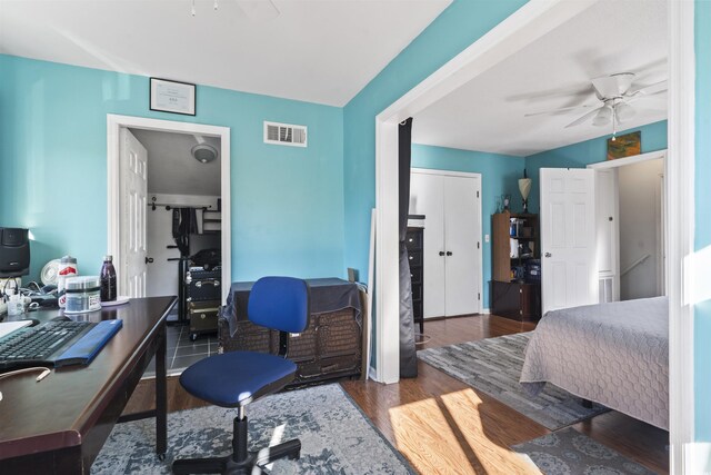 bedroom featuring ceiling fan and dark wood-type flooring