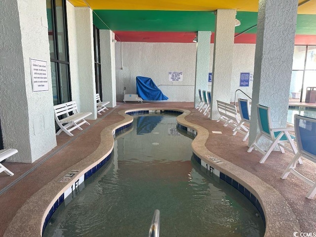 view of swimming pool featuring a patio