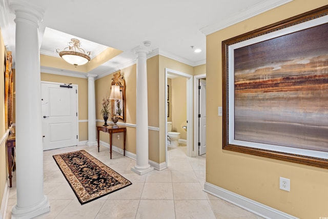 tiled foyer featuring ornamental molding