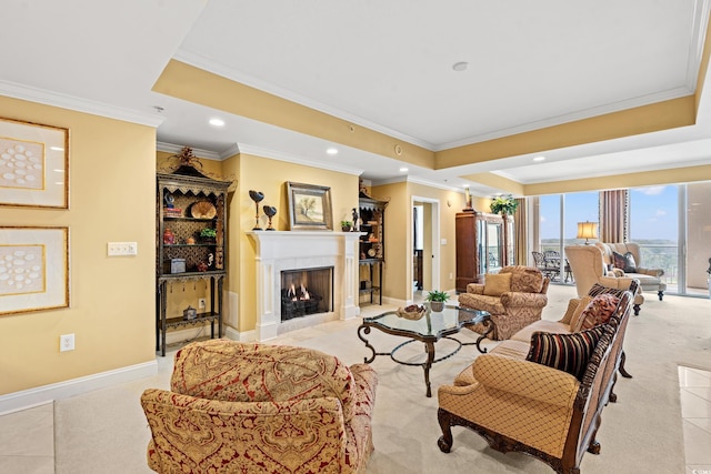 tiled living room with ornamental molding and a raised ceiling