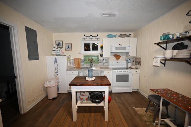 kitchen featuring wood counters, a textured ceiling, electric panel, white appliances, and white cabinets