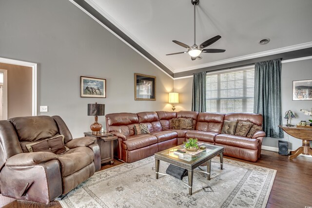 living room featuring ceiling fan, dark hardwood / wood-style floors, lofted ceiling, and crown molding