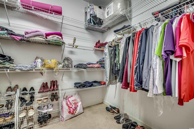 walk in closet with carpet