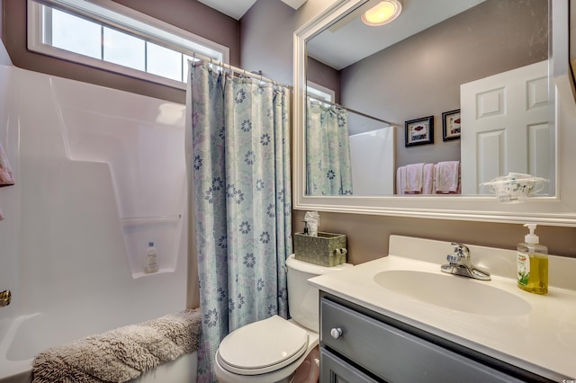 full bathroom with toilet, shower / bath combo, and vanity