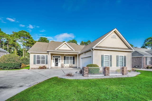 view of front of house featuring a front yard and a garage