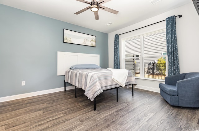 bedroom with ceiling fan and hardwood / wood-style floors