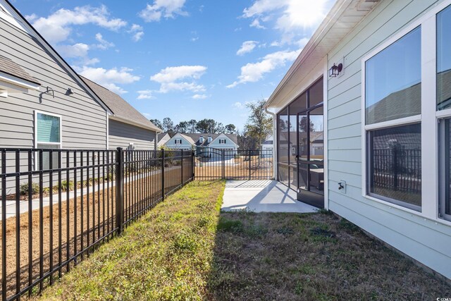 view of yard with a sunroom