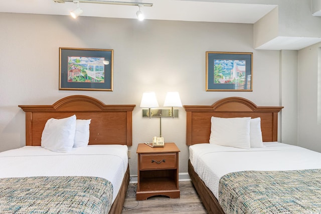 bedroom with wood finished floors