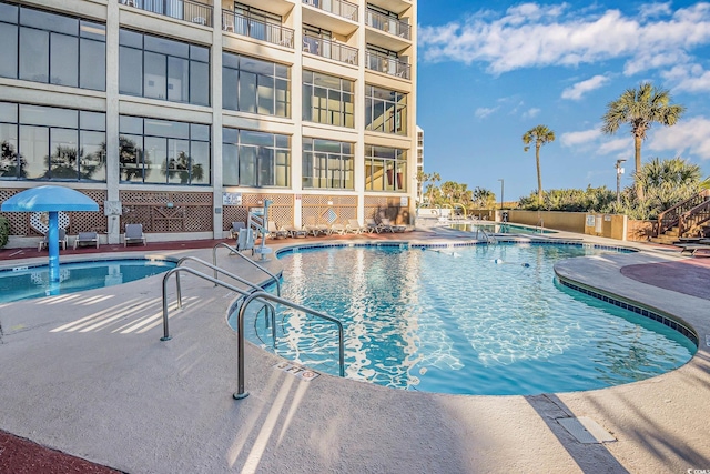 pool featuring a patio and a jacuzzi