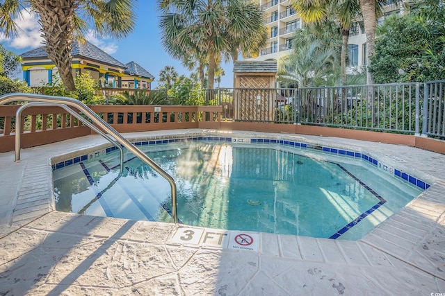 view of pool featuring a pool and fence