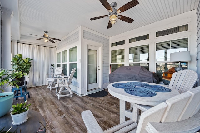 wooden terrace featuring ceiling fan