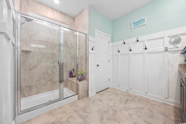 bathroom with vanity and a shower with shower door