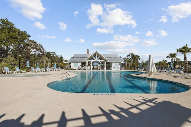 view of pool featuring a patio