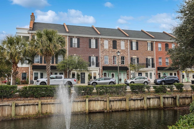 view of building exterior featuring a water view