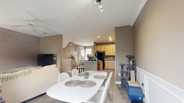 dining area with ceiling fan and light tile patterned floors