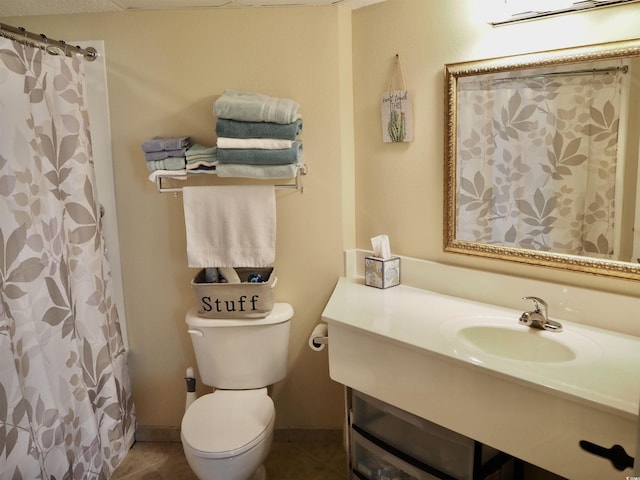 full bath with toilet, tile patterned flooring, a sink, and a shower with shower curtain