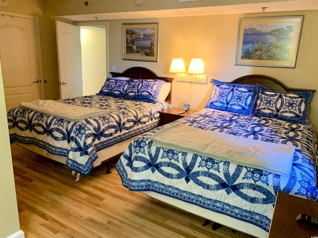 bedroom featuring wood finished floors