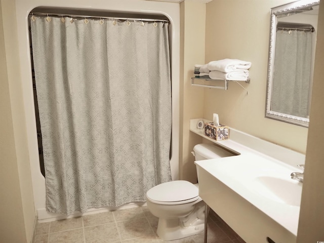 full bath with tile patterned flooring, a sink, and toilet